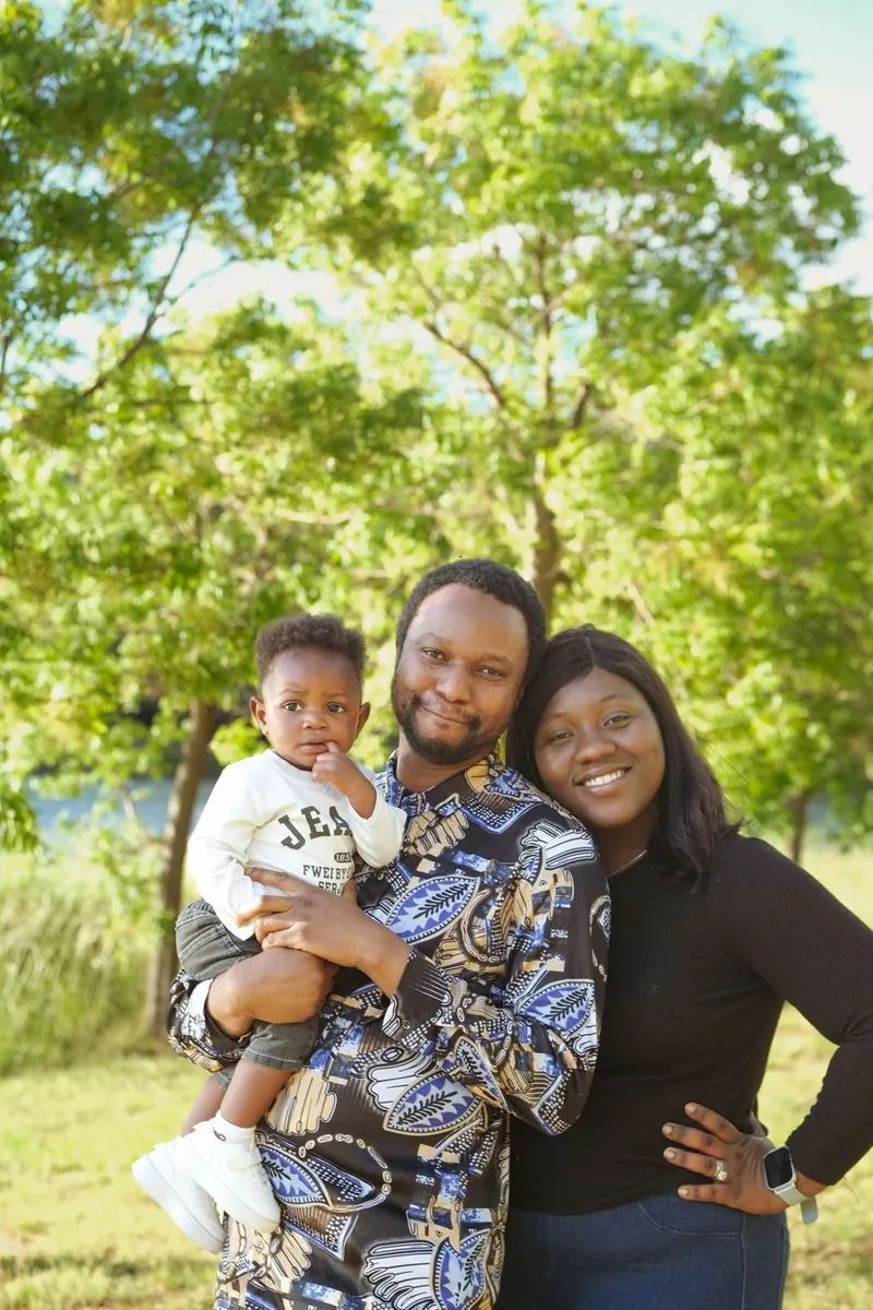 Family portrait with toddler under the trees