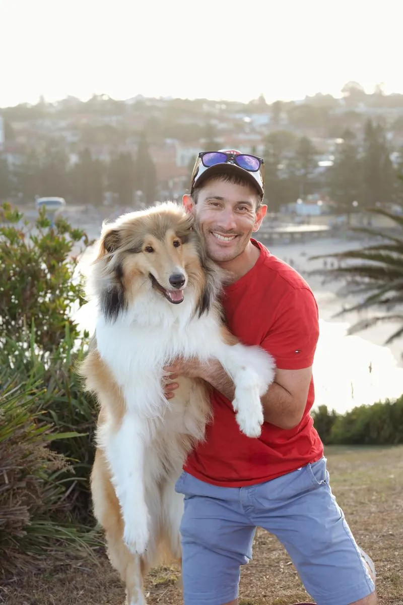 Lawrence, the photographer, with his dog by the coast