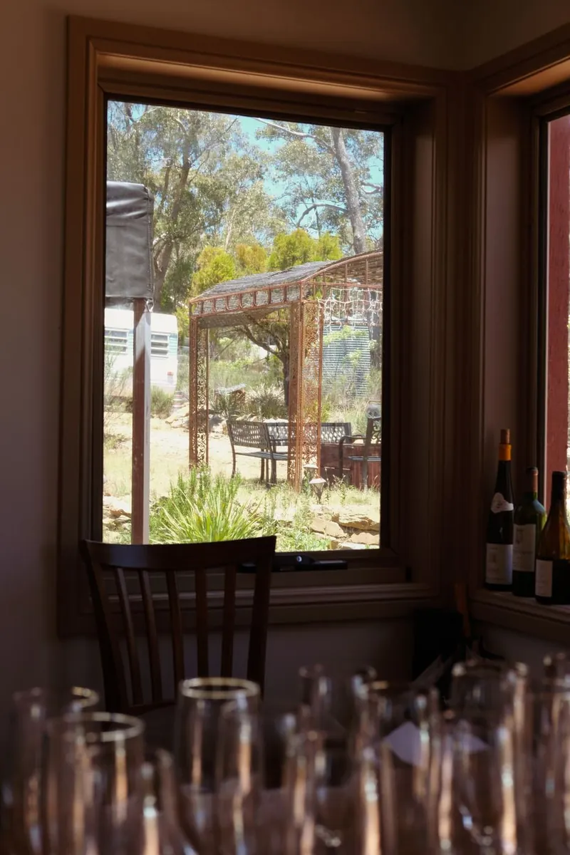 View through a window of the reception venue garden